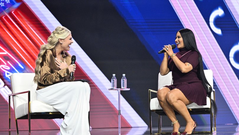 Erika Kirk and Nicki Minaj speak during Turning Point USA's AmericaFest on December 21. 