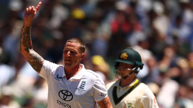 Brydon Carse celebrates the wicket of Travis Head.