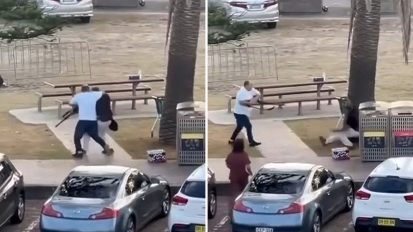 Mr Ahmed wrestles away the gun of one of the Bondi shooters.