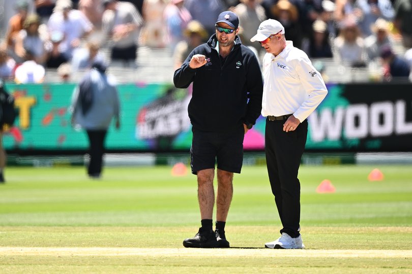 MCG Head Curator Matt Page (left) inspects the pitch during the lunch break during Day 2 of the Fourth Men’s Ashes Test.