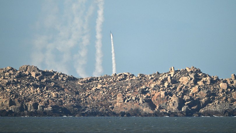 Chinese People's Liberation Army (PLA) soldiers fire a rocket into the air as they conduct military drills on Pingtan island, in eastern Chinas Fujian province, the closest point to Taiwan, on Tuesday.