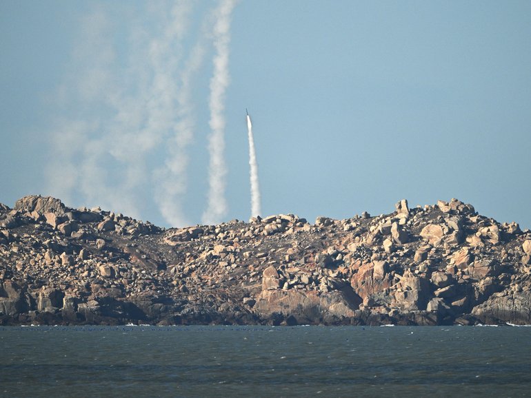 Chinese People's Liberation Army (PLA) soldiers fire a rocket into the air as they conduct military drills on Pingtan island, in eastern Chinas Fujian province, the closest point to Taiwan, on Tuesday.