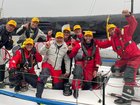 The Jackal crew are all smiles after claiming line honours in the Melbourne to Hobart yacht race. (HANDOUT/Ocean Racing Club of Victoria (ORCV))