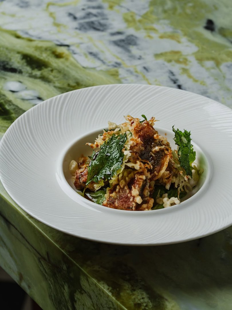 M Dining + Bar, Manila. Lightly crisped unagi layered with tempura and fresh shiso. 