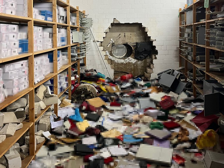 A handout photo made available by the Gelsenkirchen Police shows a hole drilled in the vault wall of a Sparkasse bank branch in Gelsenkirchen, western Germany