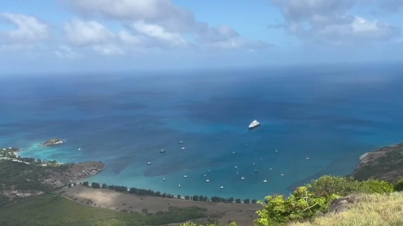 Stranded Coral Adventurer passengers return to Australia after reef strike