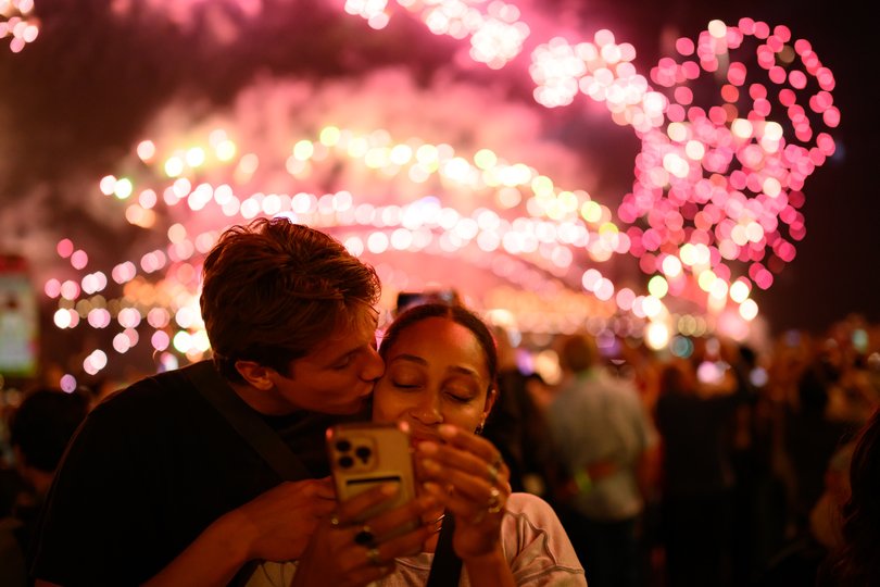 People enjoy the New Year's Eve firework display.