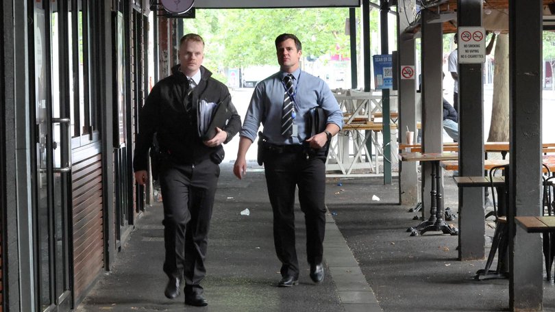 Police at the scene in Lygon St in Carlton. Picture: David Crosling