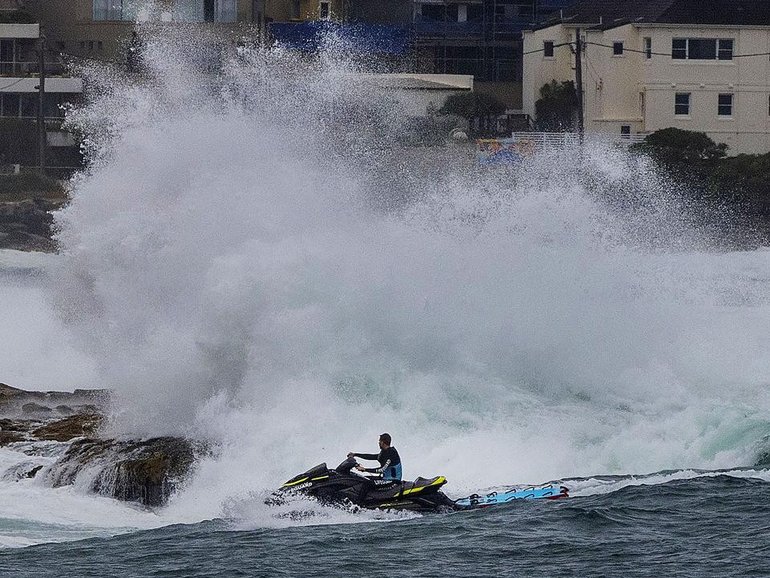 Rescuers are braving choppy conditions to search for missing swimmers off Sydney’s coast.