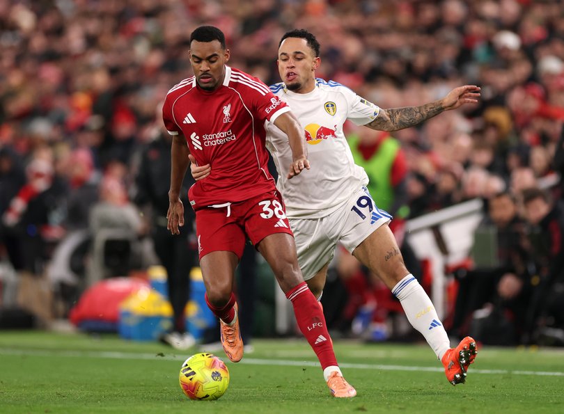 Ryan Gravenberch of Liverpool runs with the ball whilst under pressure from Noah Okafor of Leeds United during the Premier League match at Anfield on January 01, 2026.