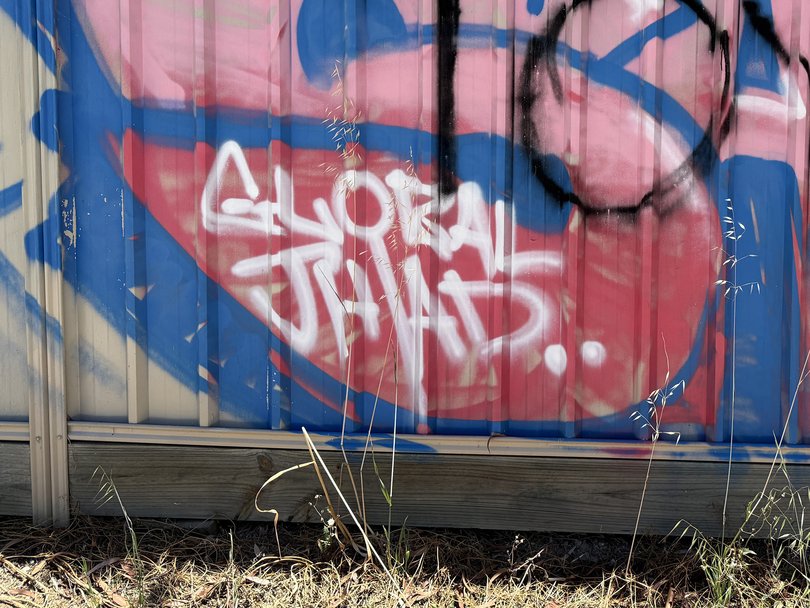 The misspelled tag was painted on top of other graffiti at least a week ago.