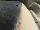 Men desperately cling on for life at edge of 40m dam