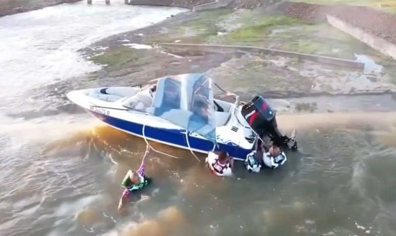 The men were clinging to the boat for several hours.