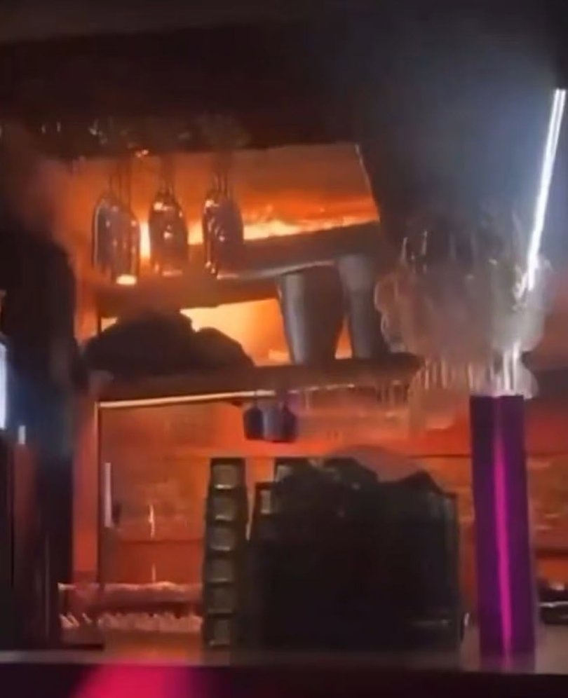 Dramatic footage shows enormous flames rapidly spreading over the ceiling of the cramped bar, as heavy music blares out of the speakers