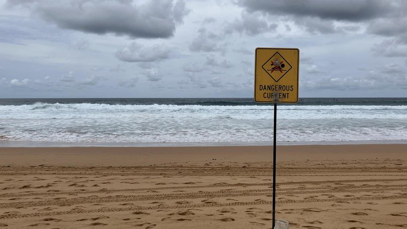 A teen has not been found after the dinghy he was in capsized near a headland on New Year's Eve. (Judy Skatssoon/AAP PHOTOS)