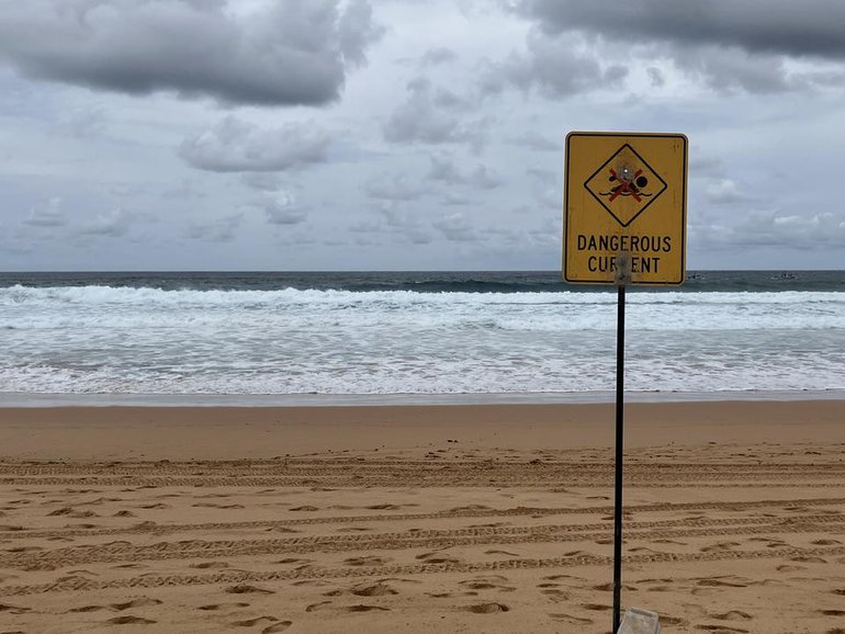 A teen has not been found after the dinghy he was in capsized near a headland on New Year's Eve. (Judy Skatssoon/AAP PHOTOS)