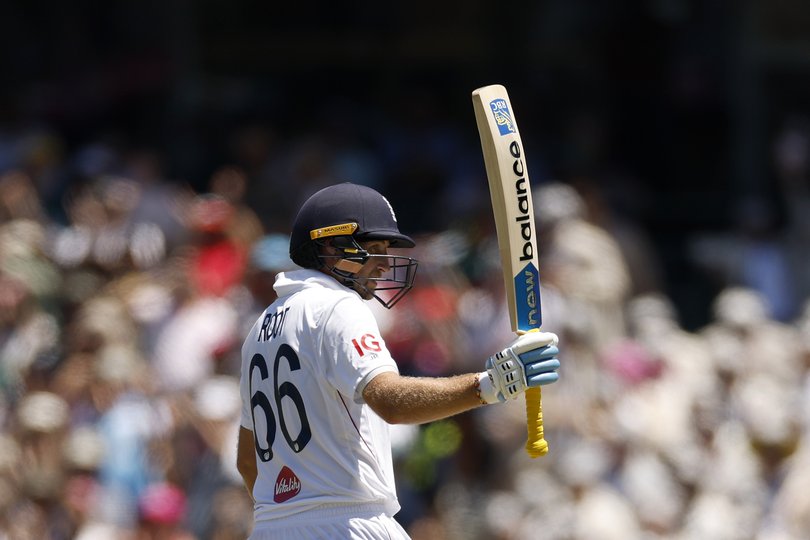 SYDNEY, AUSTRALIA - JANUARY 05: Joe Root of England raises his bat after reaching 150 runs during day two of the Fifth Test in the 2025/26 Ashes Series between Australia and England at Sydney Cricket Ground on January 05, 2026 in Sydney, Australia. (Photo by Darrian Traynor/Getty Images)