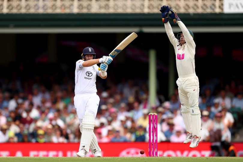 SYDNEY, AUSTRALIA - JANUARY 05: Joe Root of England bats as Alex Carey of Australia jumps to field during day two of the Fifth Test in the 2025/26 Ashes Series between Australia and England at Sydney Cricket Ground on January 05, 2026 in Sydney, Australia. (Photo by Robert Cianflone/Getty Images)