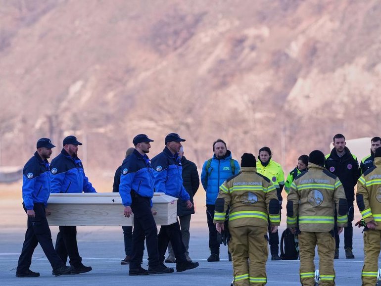 Italian authorities have flown home the bodies of several bar fire victims from Switzerland. (AP PHOTO)