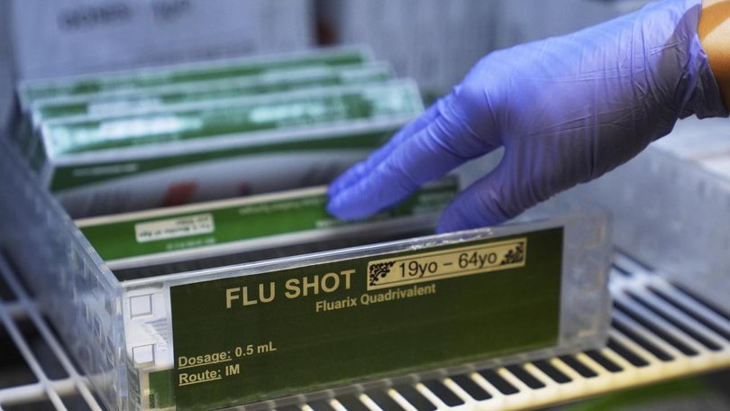 US health authorities have dropped recommendations of childhood vaccinations for the flu and others. (AP PHOTO)