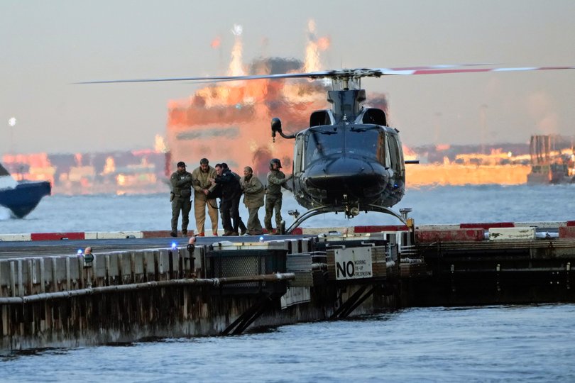 Nicolás Maduro and his wife Cilia Flores are escorted off a helicopter en route to the federal courthouse in Manhattan.