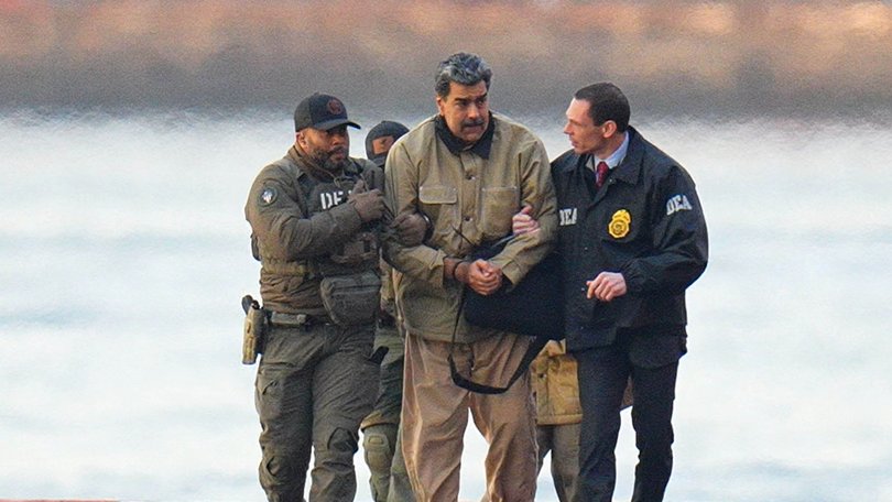Nicolas Maduro is led away from a Manhattan helipad by federal agents to face a federal court in New York.