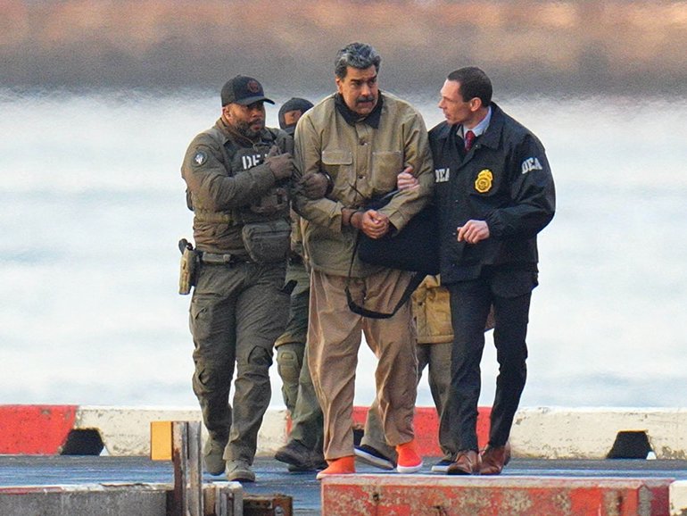 Nicolas Maduro is led away from a Manhattan helipad by federal agents to face a federal court in New York.