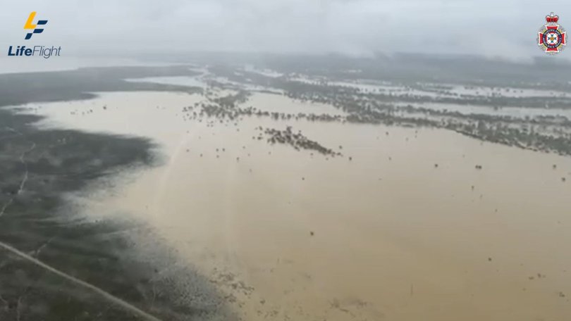 The stranded man was tracked through knee-deep mud by the helicopter crew, after severe flood saturated the area in Outback Queensland. 