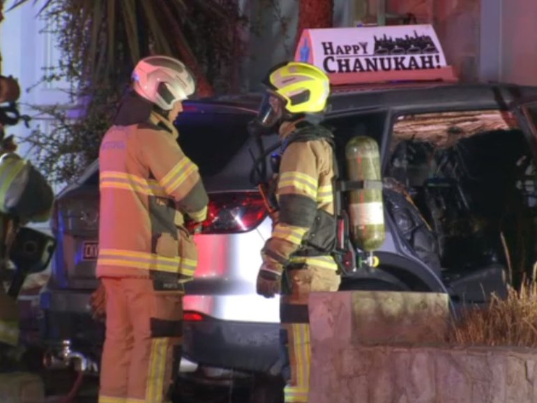 A man has been arrested over the firebombing of a prominent Melbourne rabbi’s car .