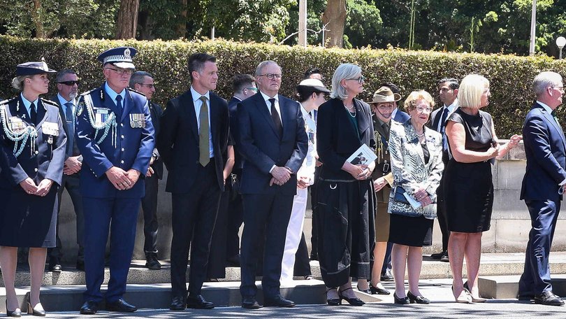 The Prime Minister joins other politicians and police officers in an honour guard for Mr Meagher. Photo: Gaye Gerard / NewsWire