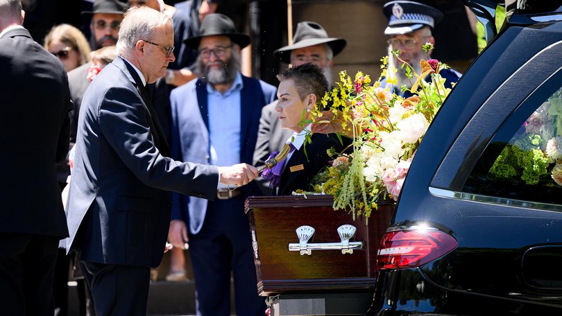 Prime Minister Anthony Albanese places holy water on the coffin of former NSW Police Detective Sergeant Peter 'Marzo' Meagher, who died in the Bondi Beach terrorist attack, at St Mary's Cathedral in Sydney, Wednesday, January 7, 2026. (AAP Image/Bianca De Marchi) NO ARCHIVING BIANCA DE MARCHI