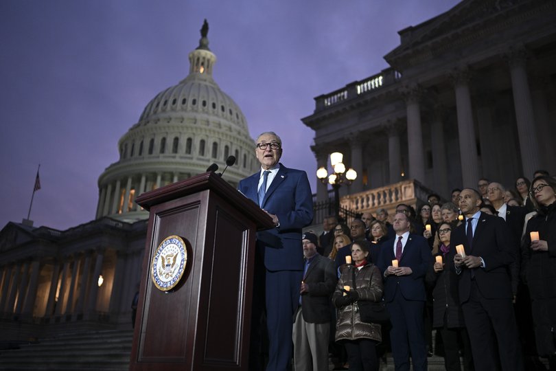 Senate Minority Leader Chuck Schumer (D-N.Y.) with Democratic members of Congress on the Senate steps to mark the 5th anniversary of the January 6 riot.