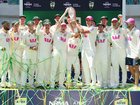 Australian players celebrate with the Ashes Waterford Crystal trophy after winning the Ashes series 4-1.