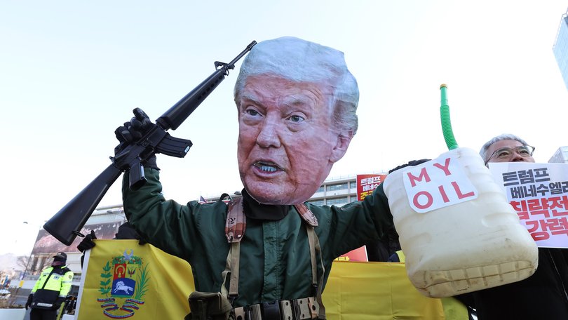 South Koreans protest the President’s motivation for capturing Maduro.