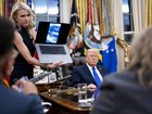 Natalie Harp, an aide to President Donald Trump, shows a video of the fatal shooting of Renee Nicole Good in Minneapolis, during an interview with New York Times journalists, in the Oval Office of the White House in Washington on Wednesday evening, Jan. 7, 2026. B