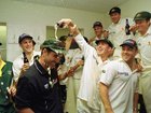 Australia celebrate in the dressing room after winning the fourth day of the England versus Australia first test match at Edgbaston, Birmingham. Justin Langer is covered in beer by replacement Damien Martyn. 