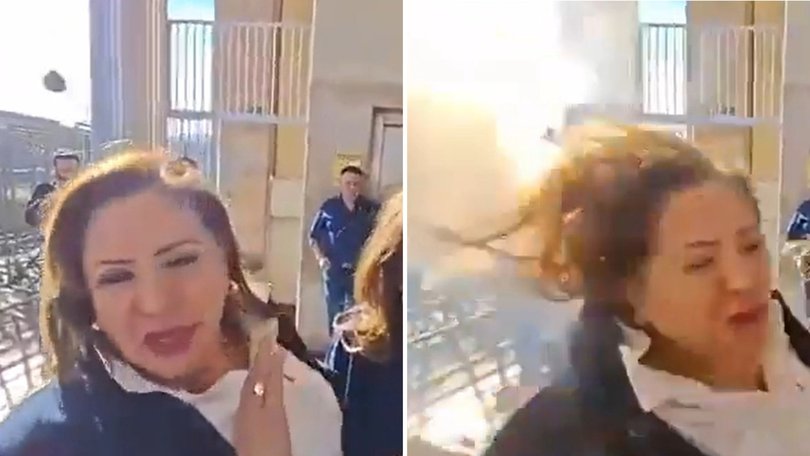 The shocking moment a politician was struck in the head with a homemade explosive device has been caught on camera.