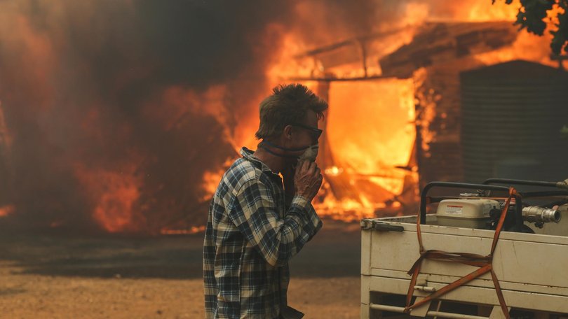 Y5 Farmers and locals work to defend property near Yarck. The out of control Longwood bushfire has worsened and is now threatening more communities to the south. Picture: NewsWire/ Jason Edwards