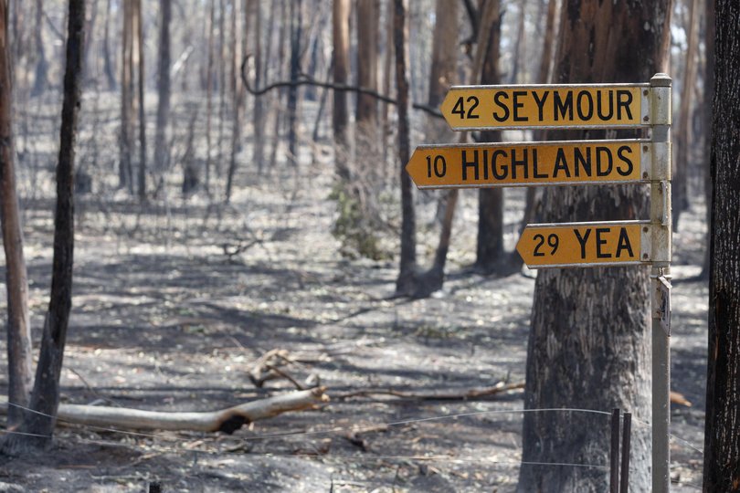 Fire-damaged road signs are seen on January 10, 2026 near Longwood, Australia.