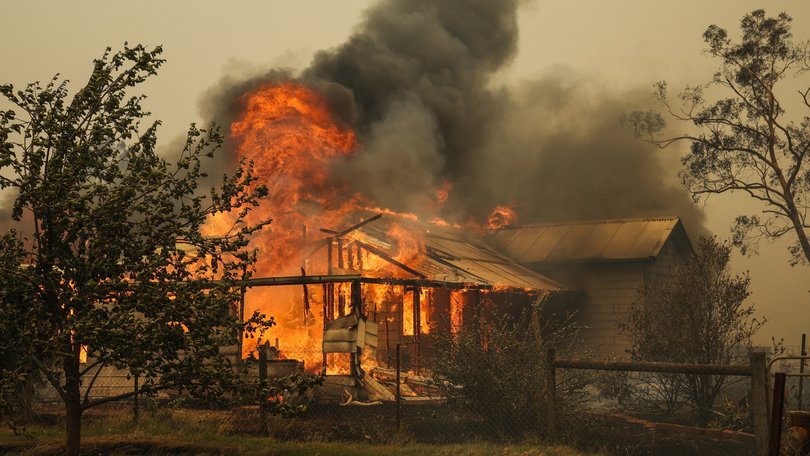 Farmers and locals work to defend property near Yarck, in central Victoria.