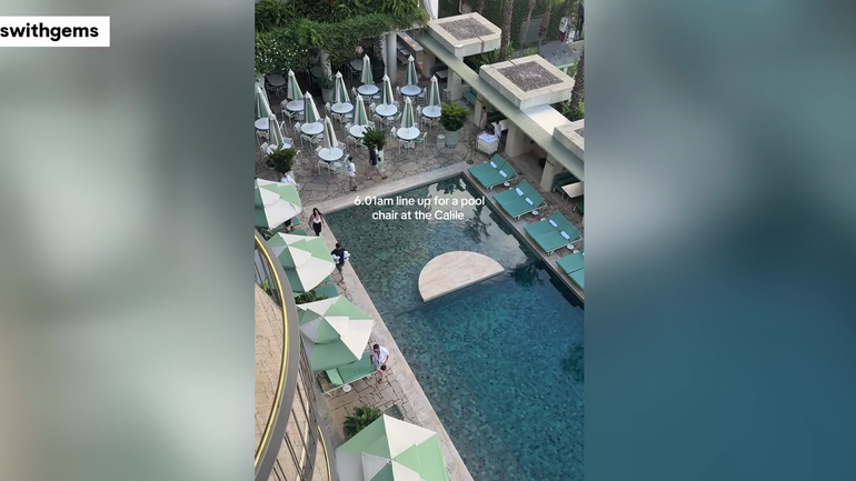 Woman's husband queues for pool chair, sparking social media debate