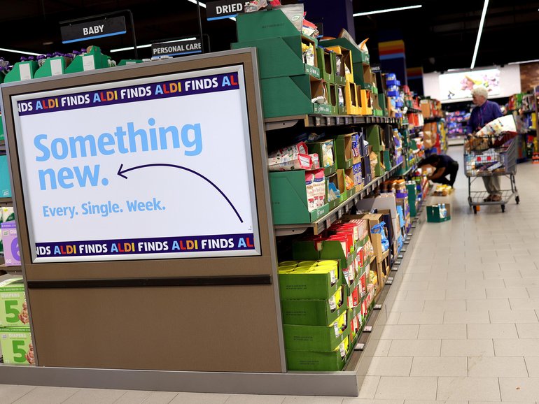 Shoppers at an Aldi store in Washington, DC. By the end of 2028, the German chain hopes to have an additional 800 stores in the US. 