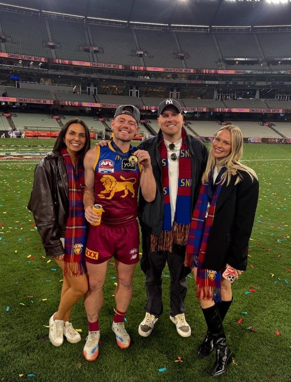 Lachie Neale and Jules Neale with Ben Crosley and Tess Crosley after Brisbane's 2025 grand final win. This photo has since been taken down.