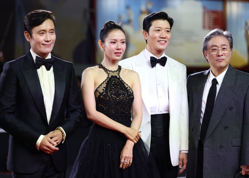 Actors Lee Byung-hun, Son Ye-jin, Park Hee-soon and director Park Chan-wook at the No Other Choice premiere at the Venice Film Festival.