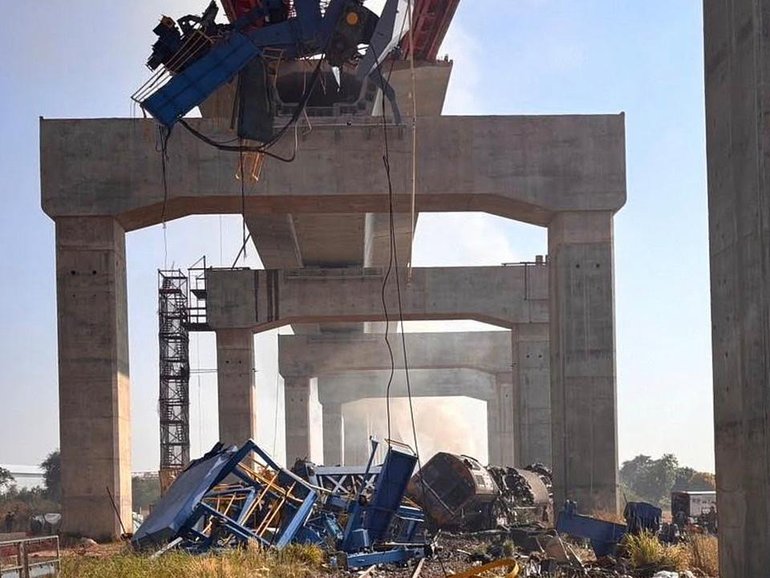 A crane that was being used to build an elevated high-speed railway fell onto a train in Thailand. (AP PHOTO)