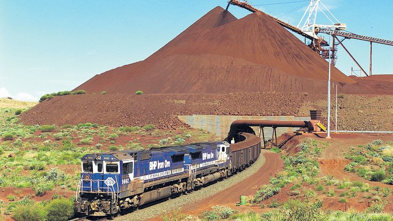A train loaded with iron ore departs the BHP Iron Oreís Yandi Mine in the Pilbara.