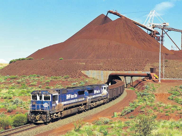 A train loaded with iron ore departs the BHP Iron Oreís Yandi Mine in the Pilbara.