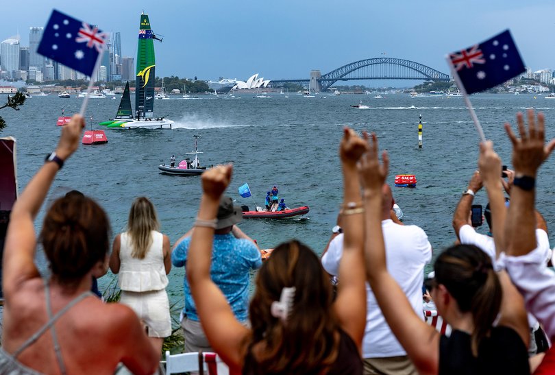 Spectators on Shark Island watch the action as Australia SailGP Team helmed by Tom Slingsby crosses the finish line to win on Race Day 1 of the KPMG Australia Sail Grand Prix in Sydney, Australia. Saturday 8 February 2025.