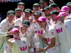 Australia’s captain Steve Smith (2nd L) takes a selfie with team mates as they celebrate with the Waterford Crystal Ashes Trophy at the end of the fifth Ashes cricket Test.