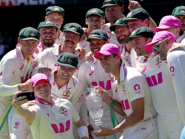Australia’s captain Steve Smith (2nd L) takes a selfie with team mates as they celebrate with the Waterford Crystal Ashes Trophy at the end of the fifth Ashes cricket Test.